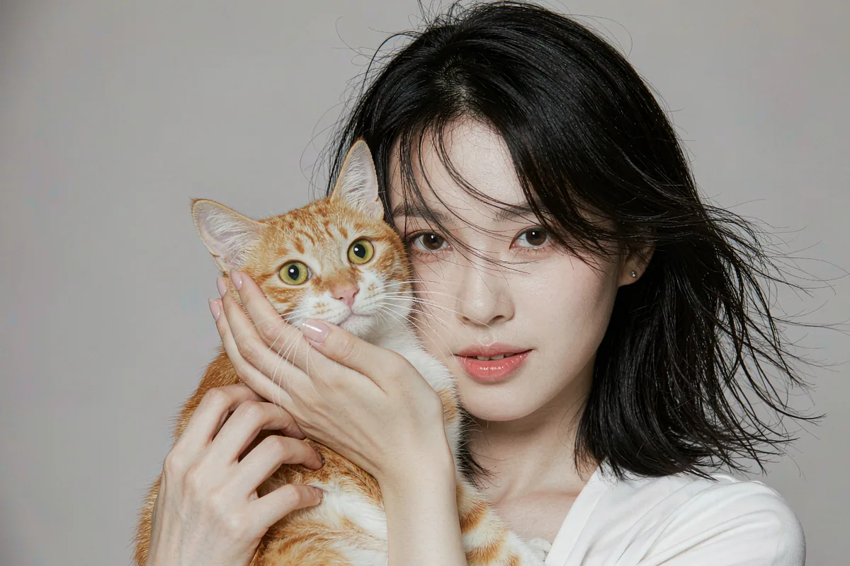 AI-generated Studio Portrait portrait of a person with their Ginger tabby cat